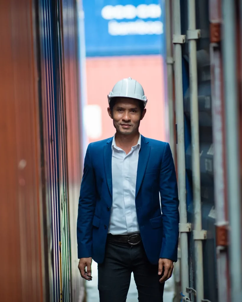 portrait-of-foreman-worker-standing-at-container-cargo-harbor-to-loading-containers.webp
